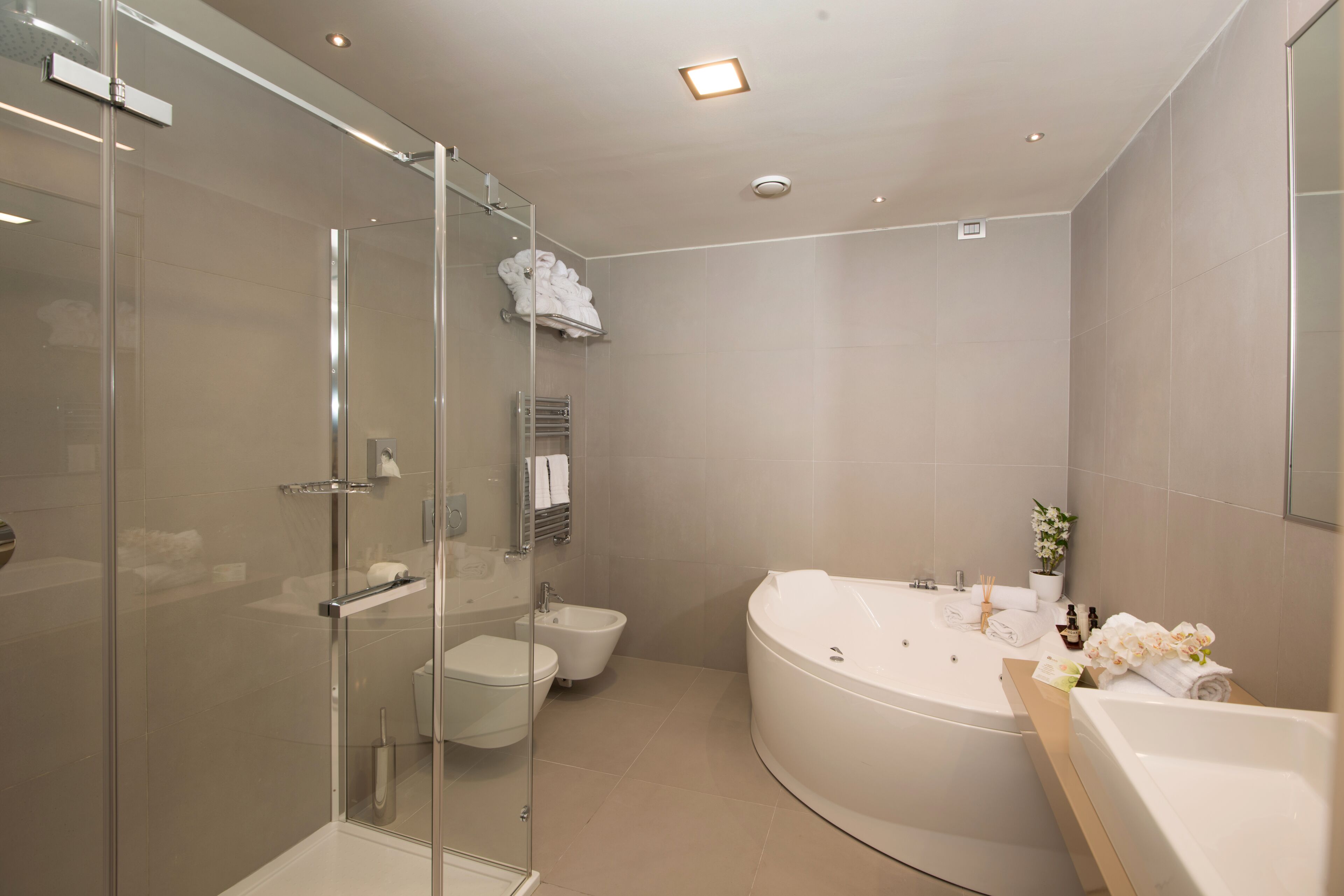 suite | bathroom | shower, designer toiletries, hair dryer, slippers