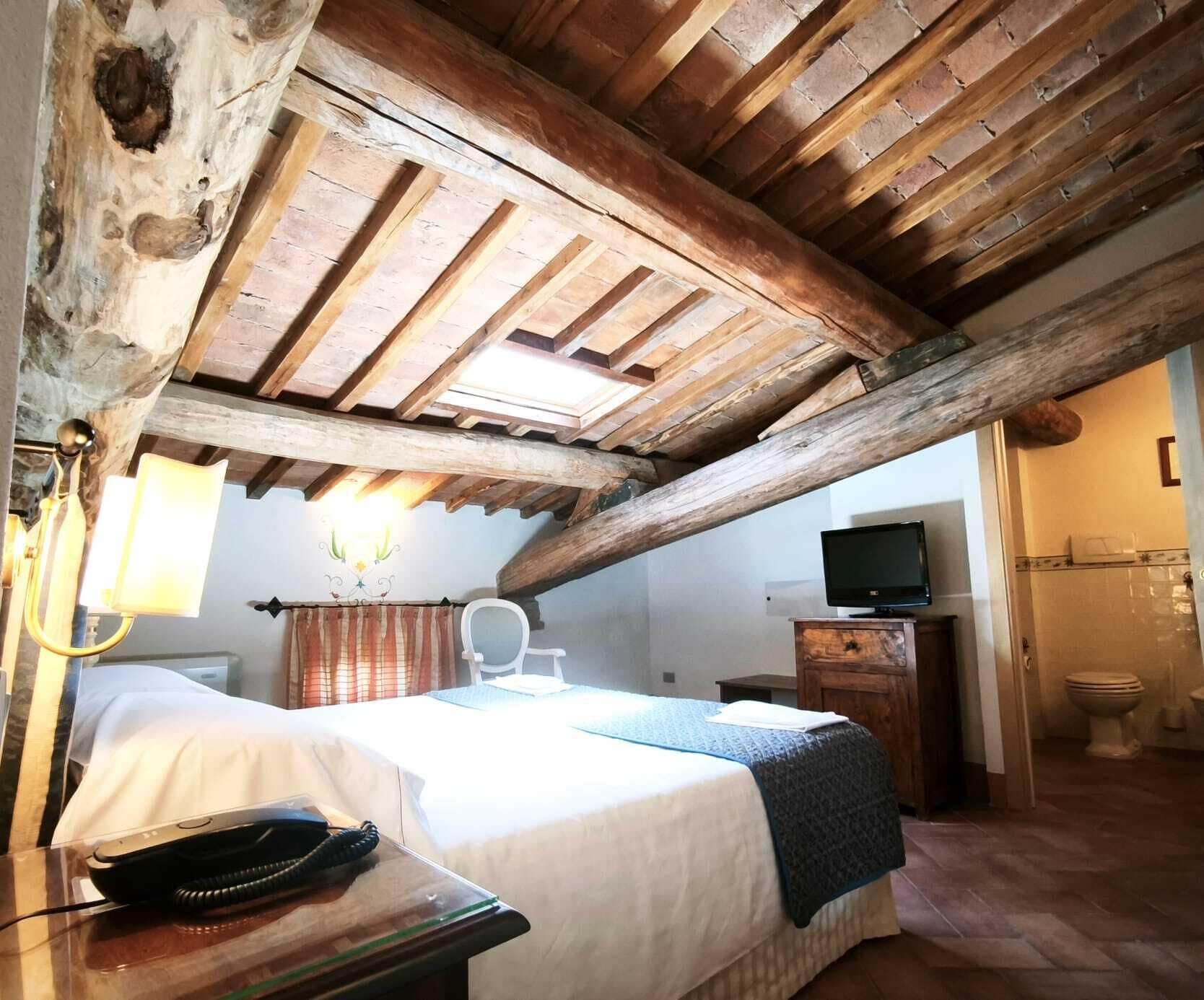 Junior Suite in Mansarda | Premium-sengetøj, minibar, pengeskab på værelset, individuelt design