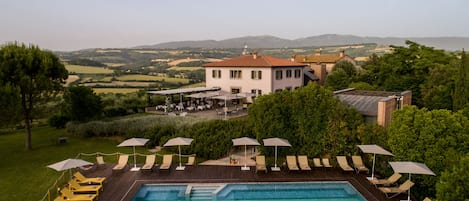 Indoor pool, outdoor pool, open 10 AM to 8 PM, pool loungers