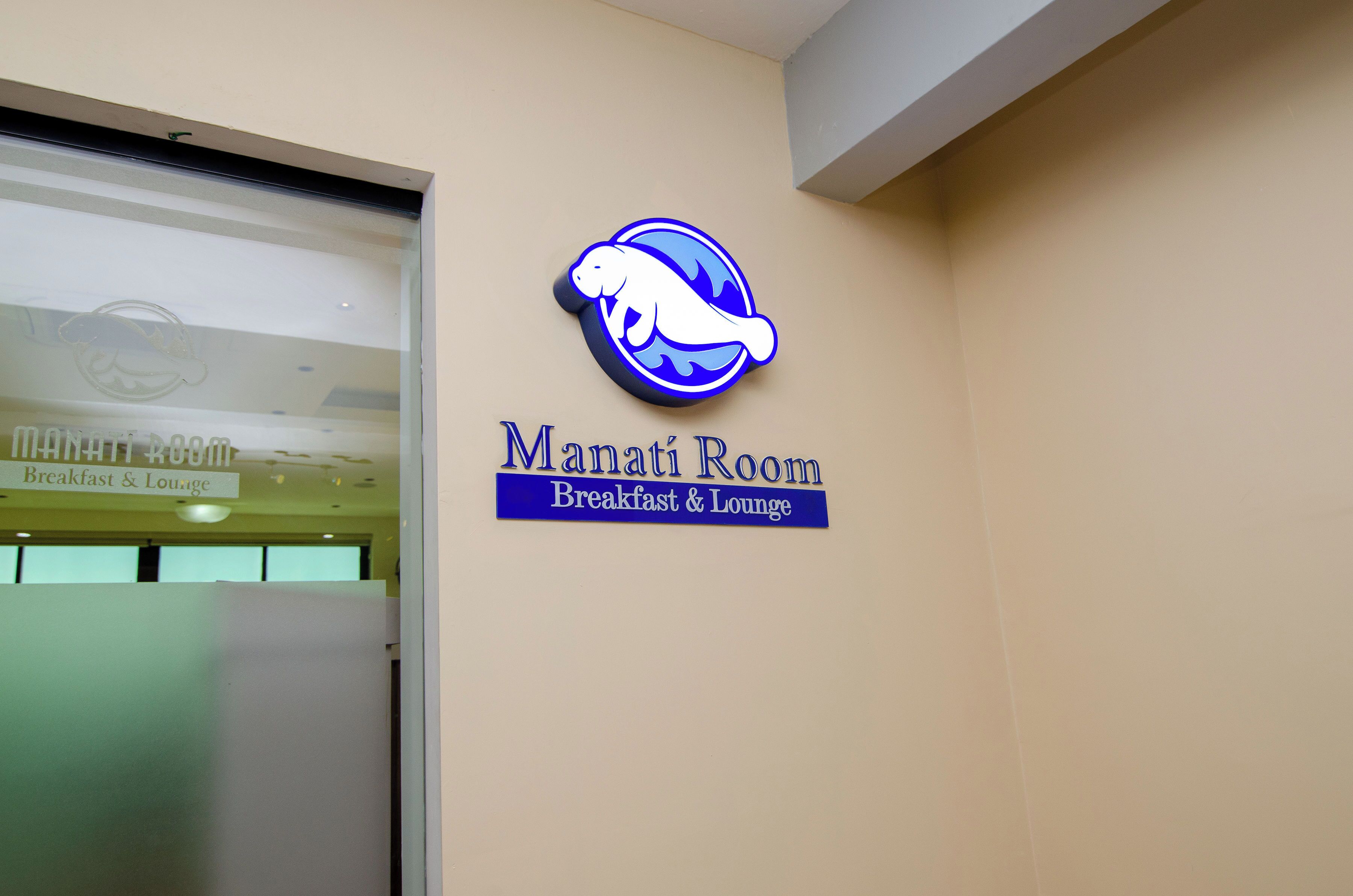A sign for Manati Room, labeled as a breakfast and lounge area.