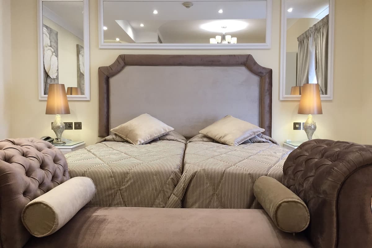 double or twin room | minibar, in-room safe, individually decorated, desk