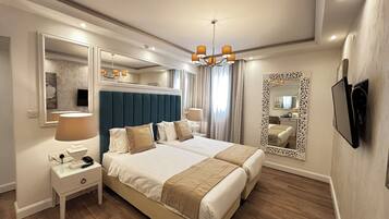 Double or Twin Room | Minibar, in-room safe, individually decorated, desk