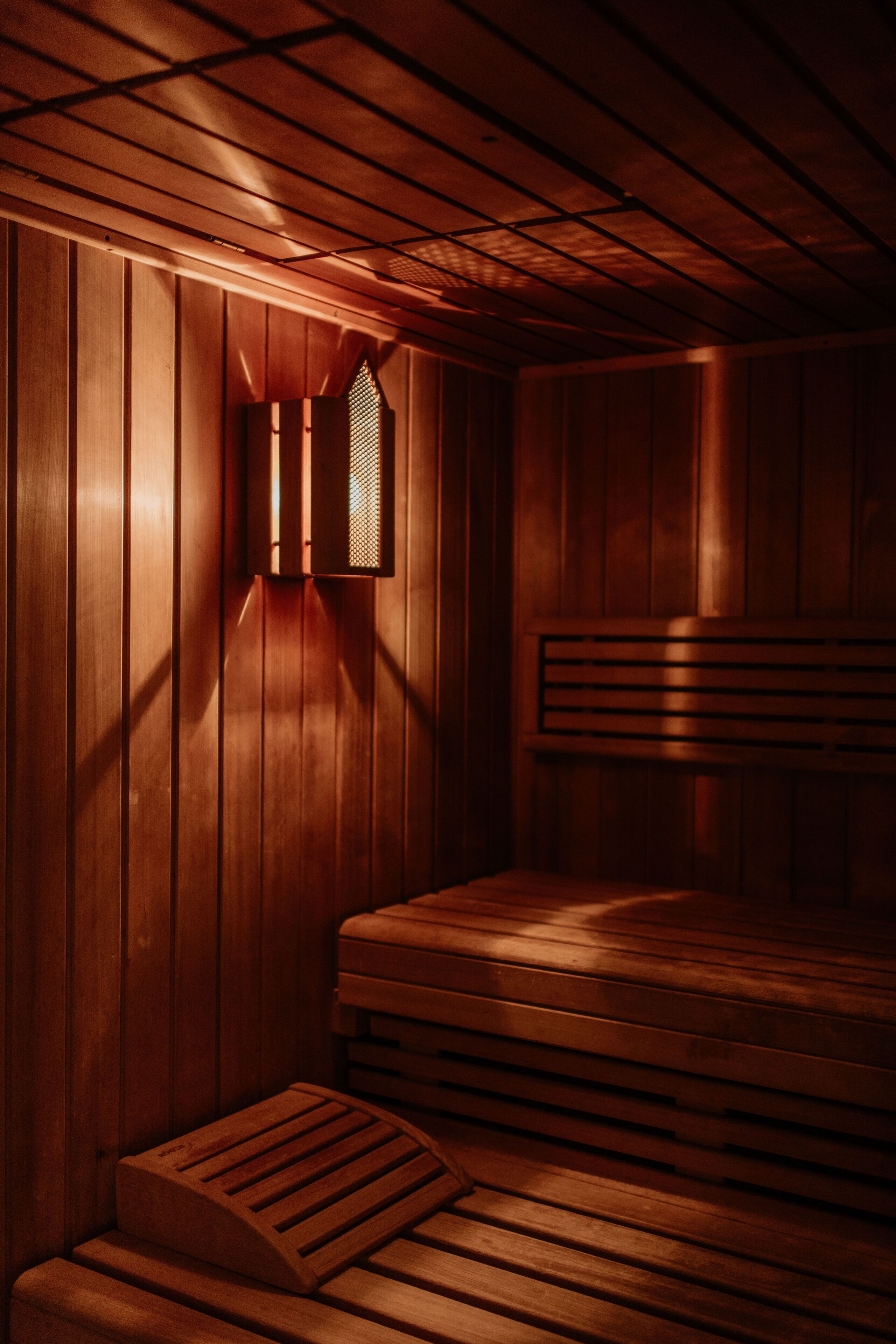 A sauna with wooden walls and benches.