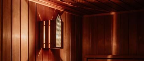 A sauna with wooden walls and benches.