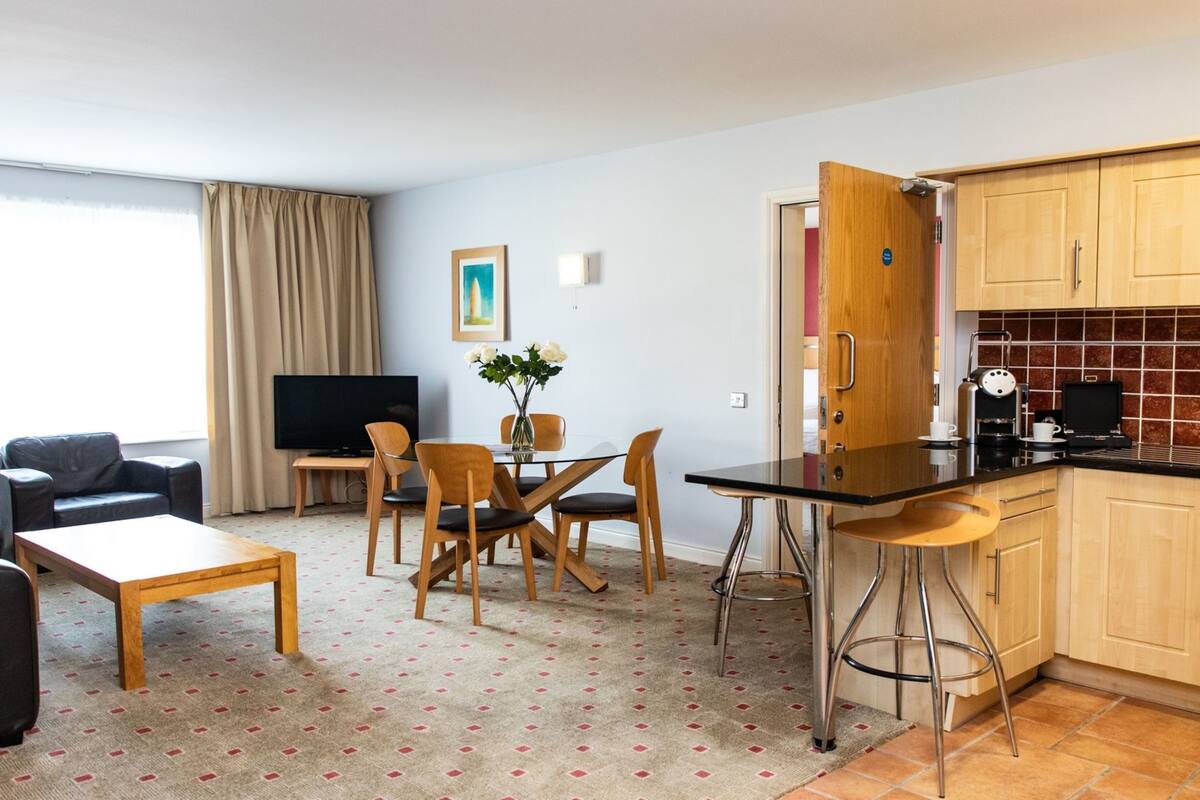 suite, 2 bedrooms | living area | tv