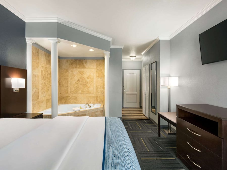 Premium bedding, pillow-top beds, desk, laptop workspace