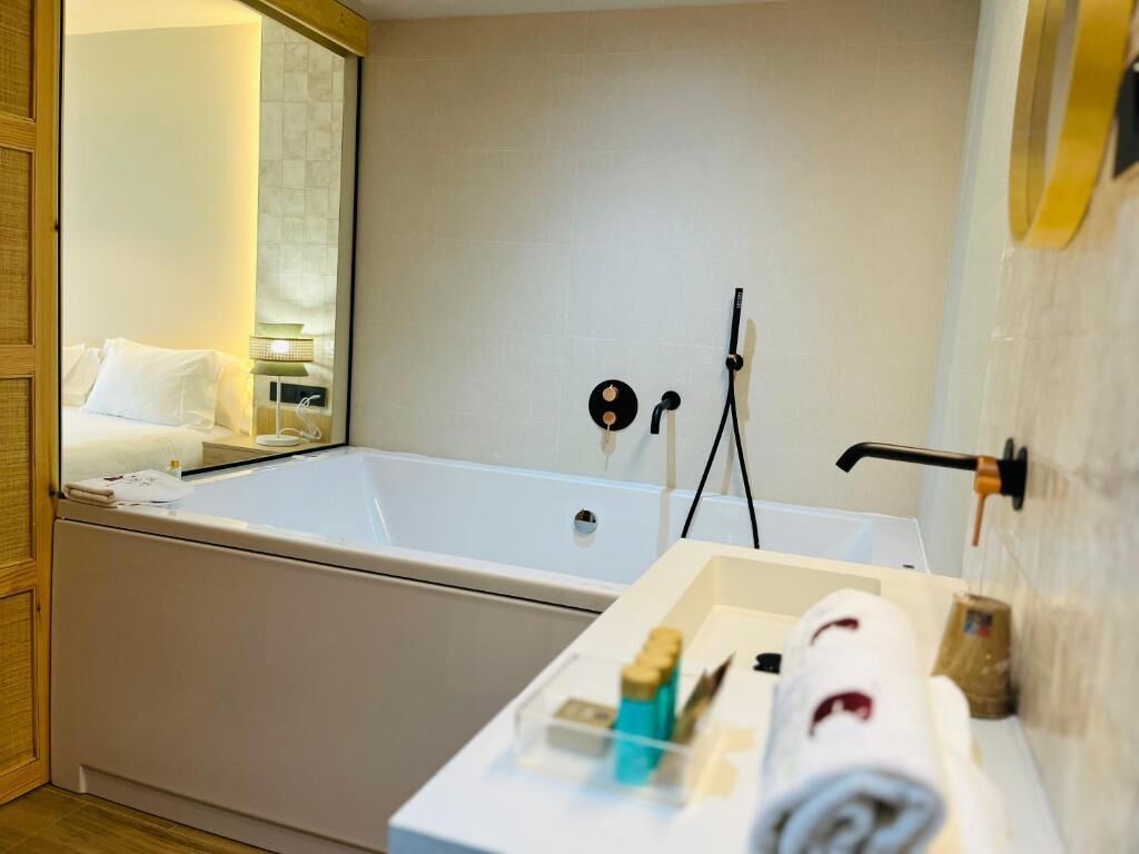superior room | bathroom | bathtub, deep-soaking bathtub, free toiletries, hair dryer