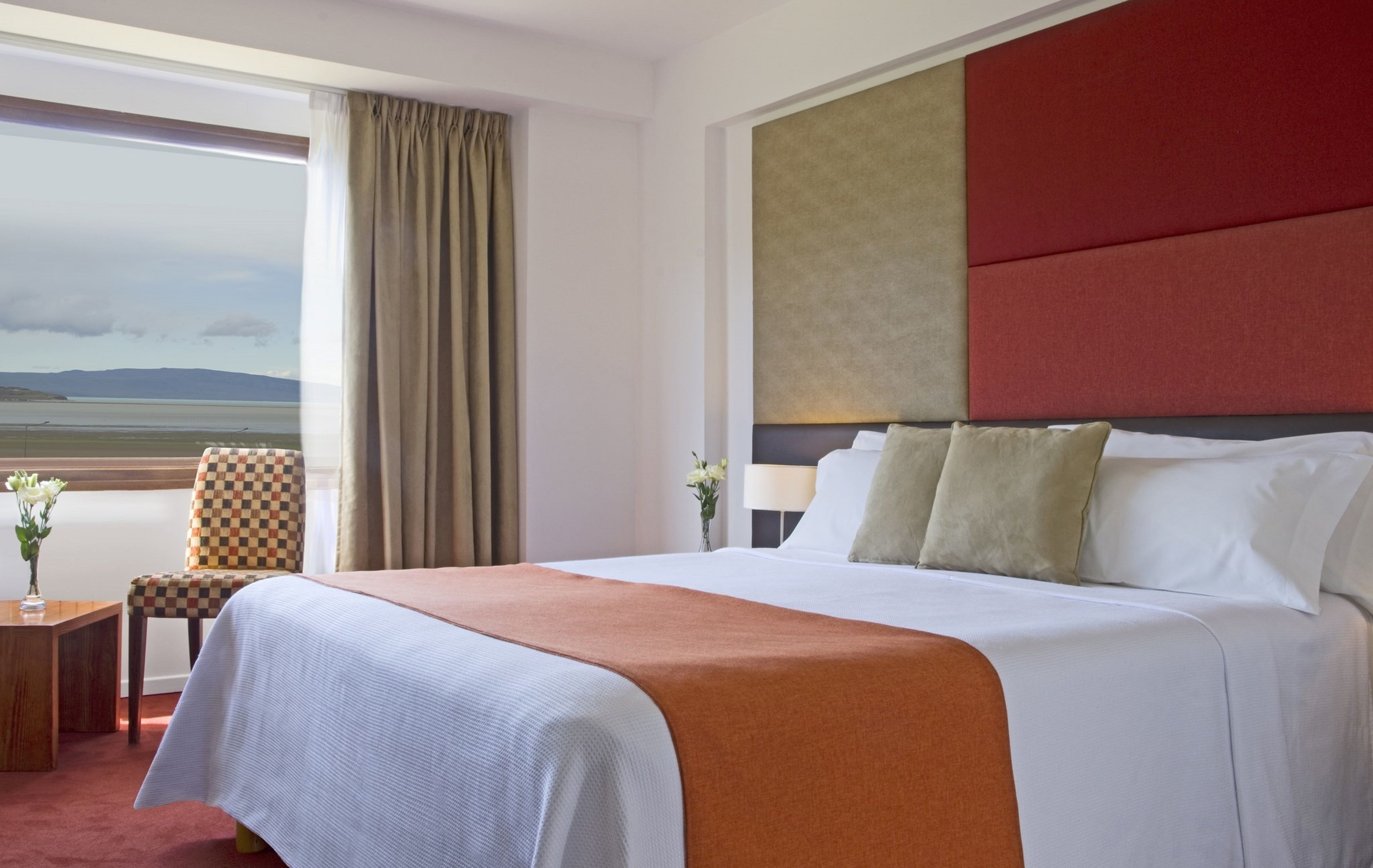 deluxe room, 1 queen bed, lake view | 1 bedroom, minibar, in-room safe, individually decorated