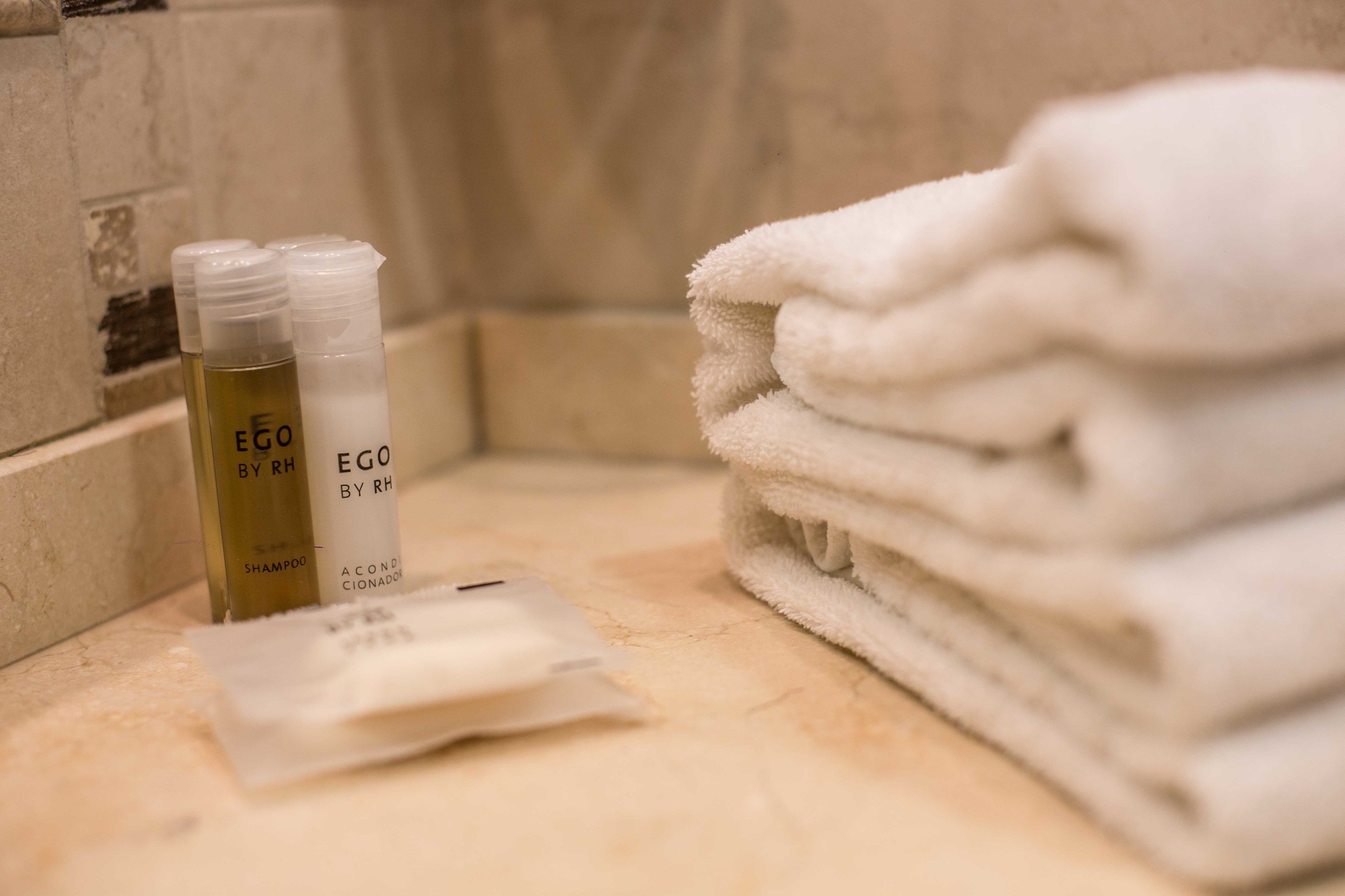 deep-soaking bathtub, hair dryer, towels