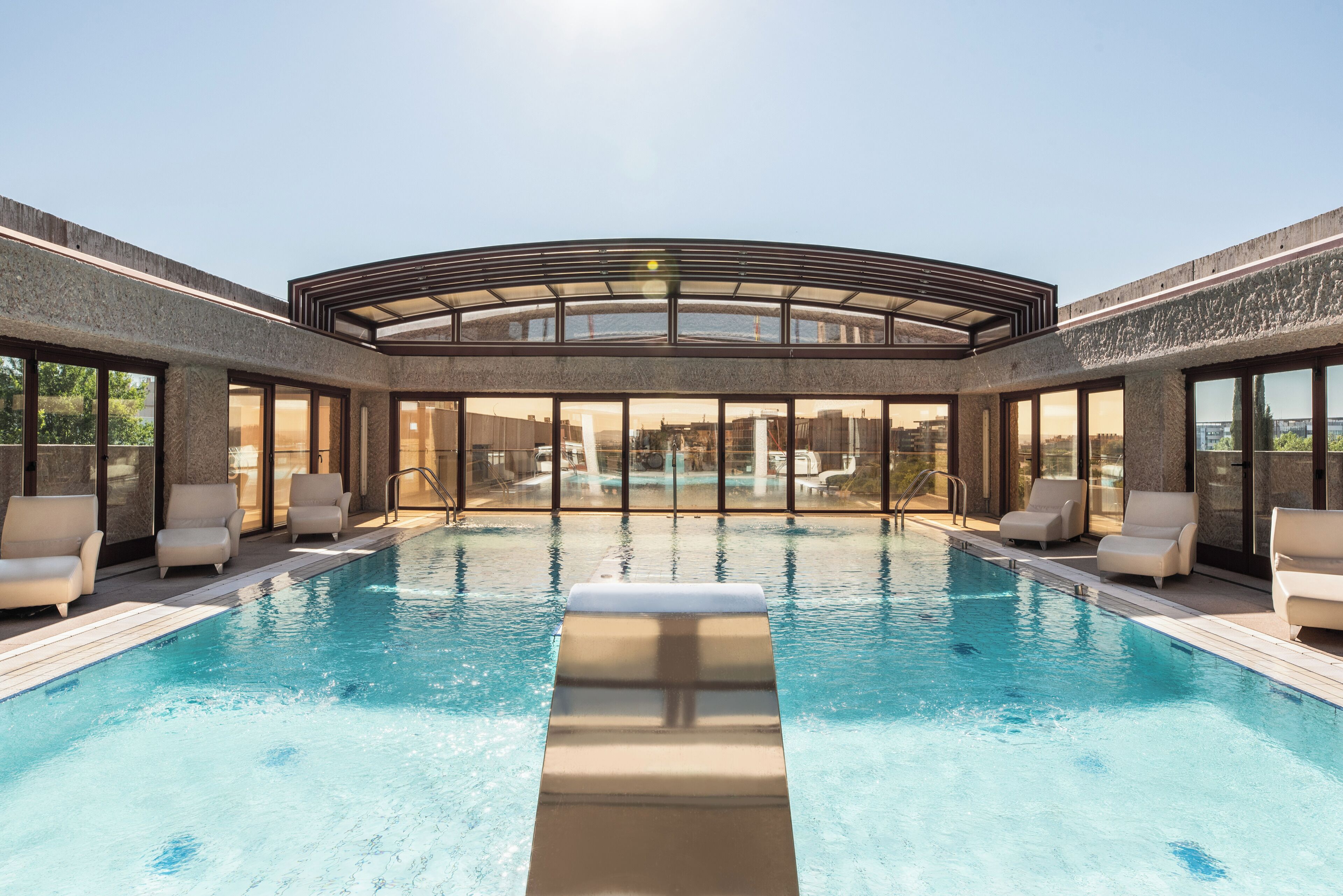 Seasonal outdoor pool, open 8:00 AM to 8:00 PM, pool loungers