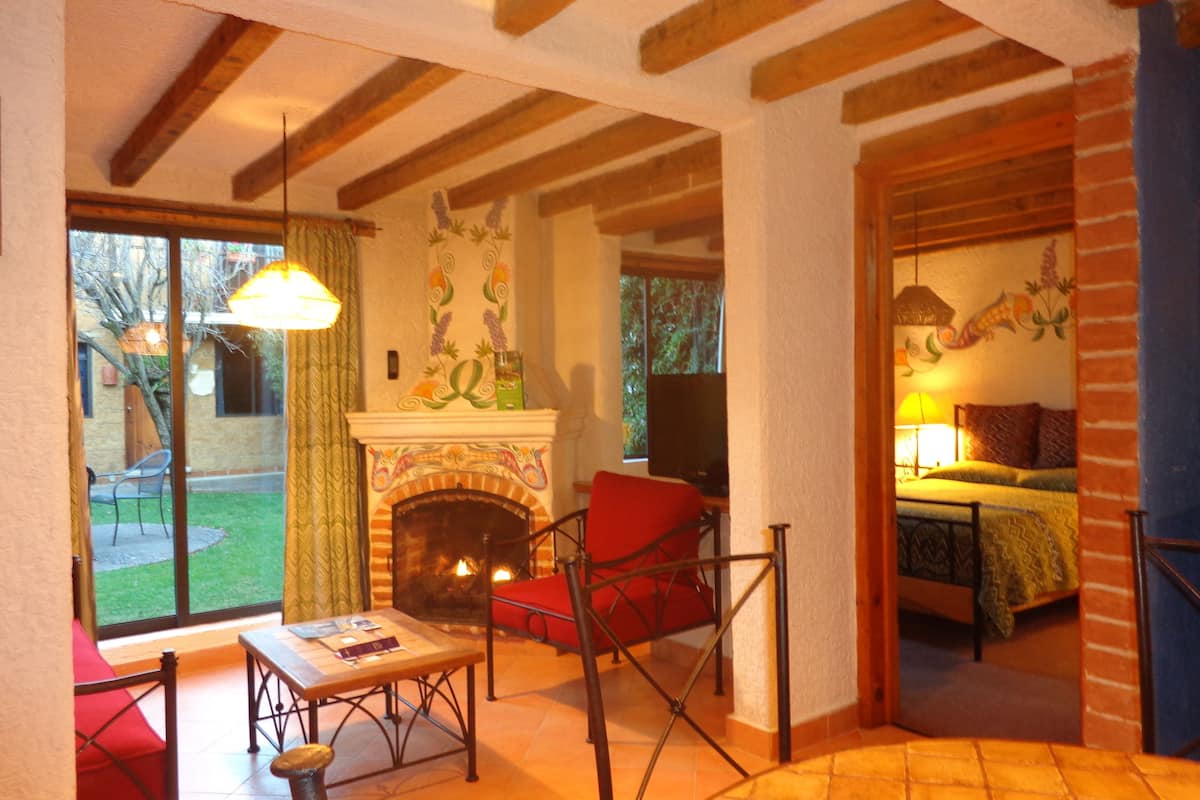 junior suite | living area | 32-inch lcd tv with cable channels, tv, ipod dock