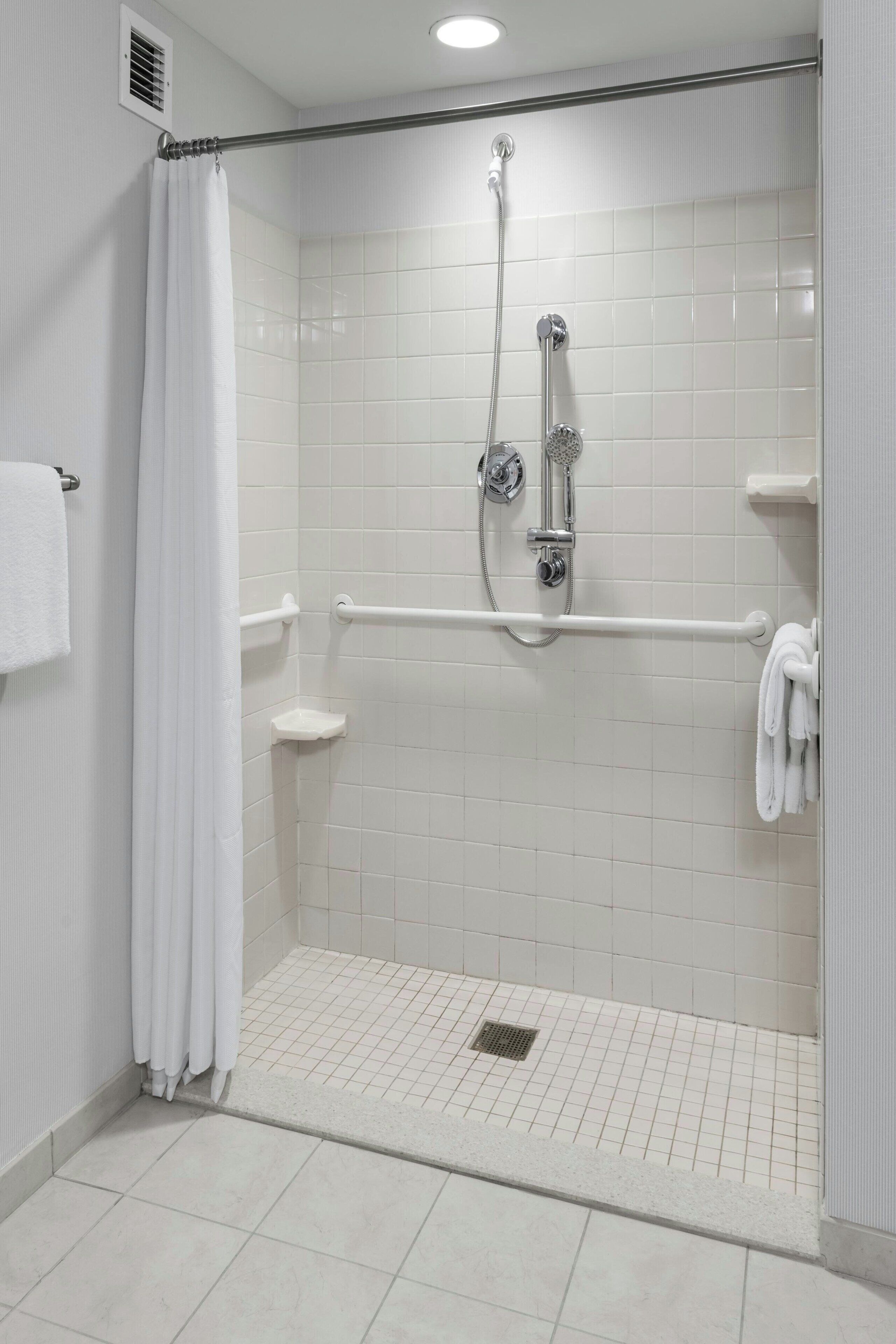 room, 1 king bed | bathroom | combined shower/bathtub, designer toiletries, hair dryer, towels