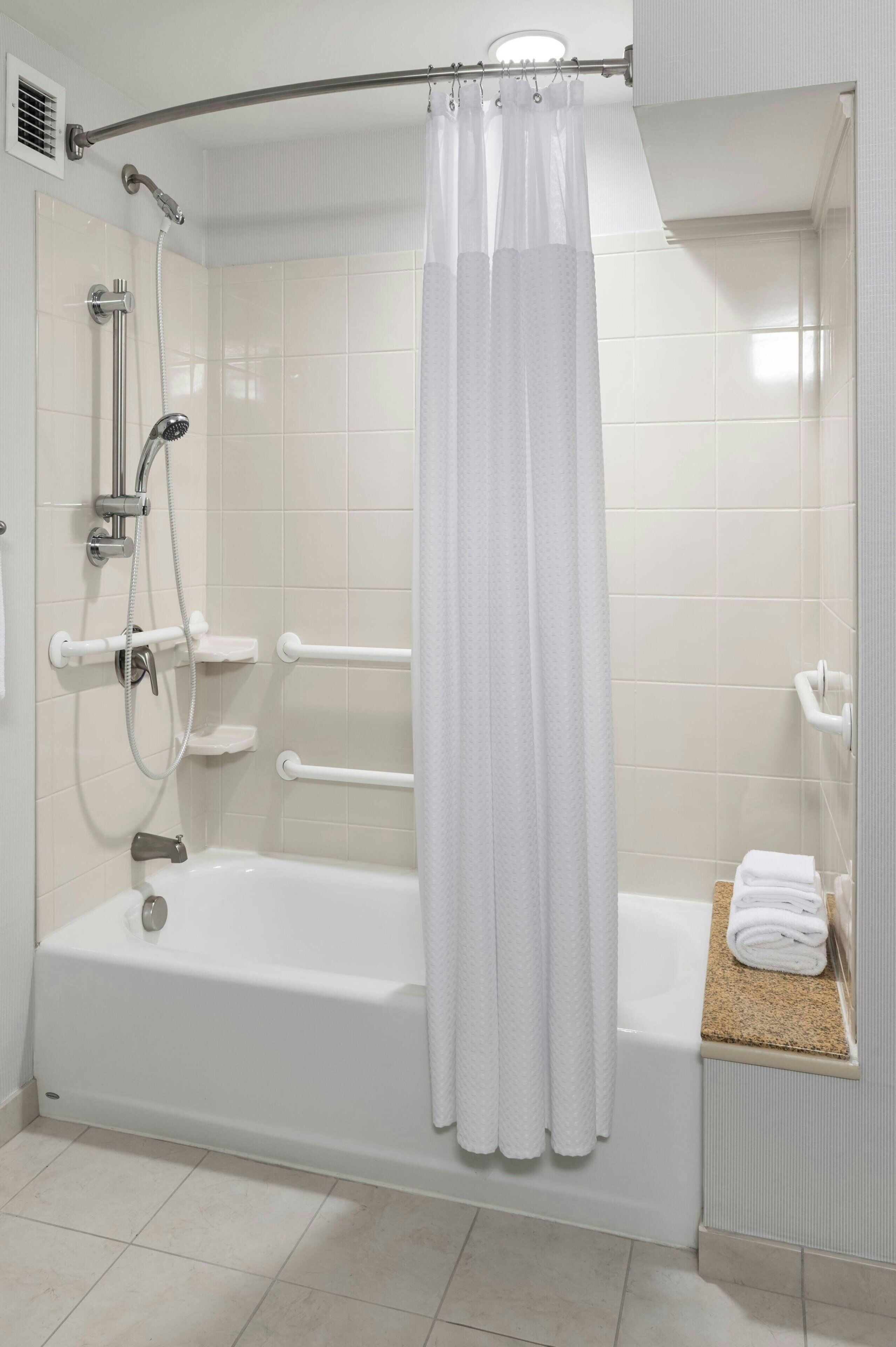 room, 2 queen beds | bathroom | combined shower/bathtub, designer toiletries, hair dryer, towels