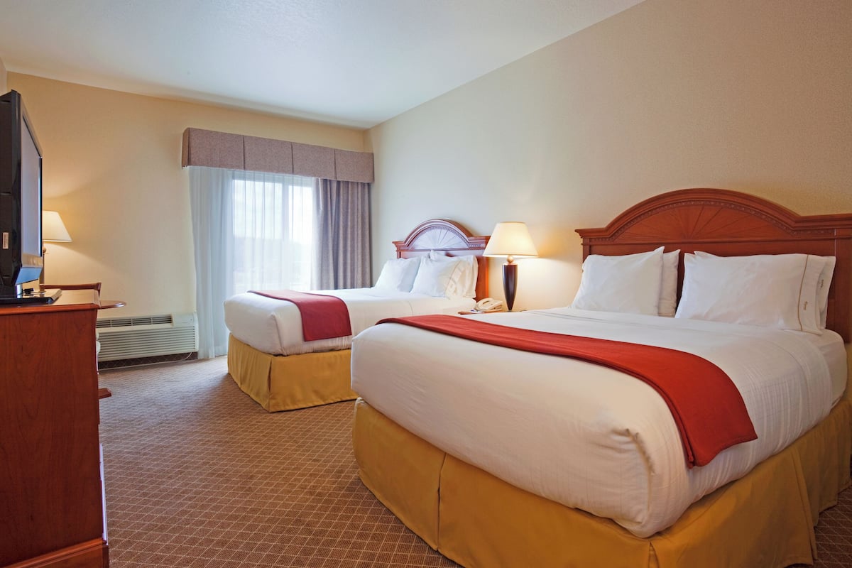 Premium bedding, desk, laptop workspace, blackout drapes