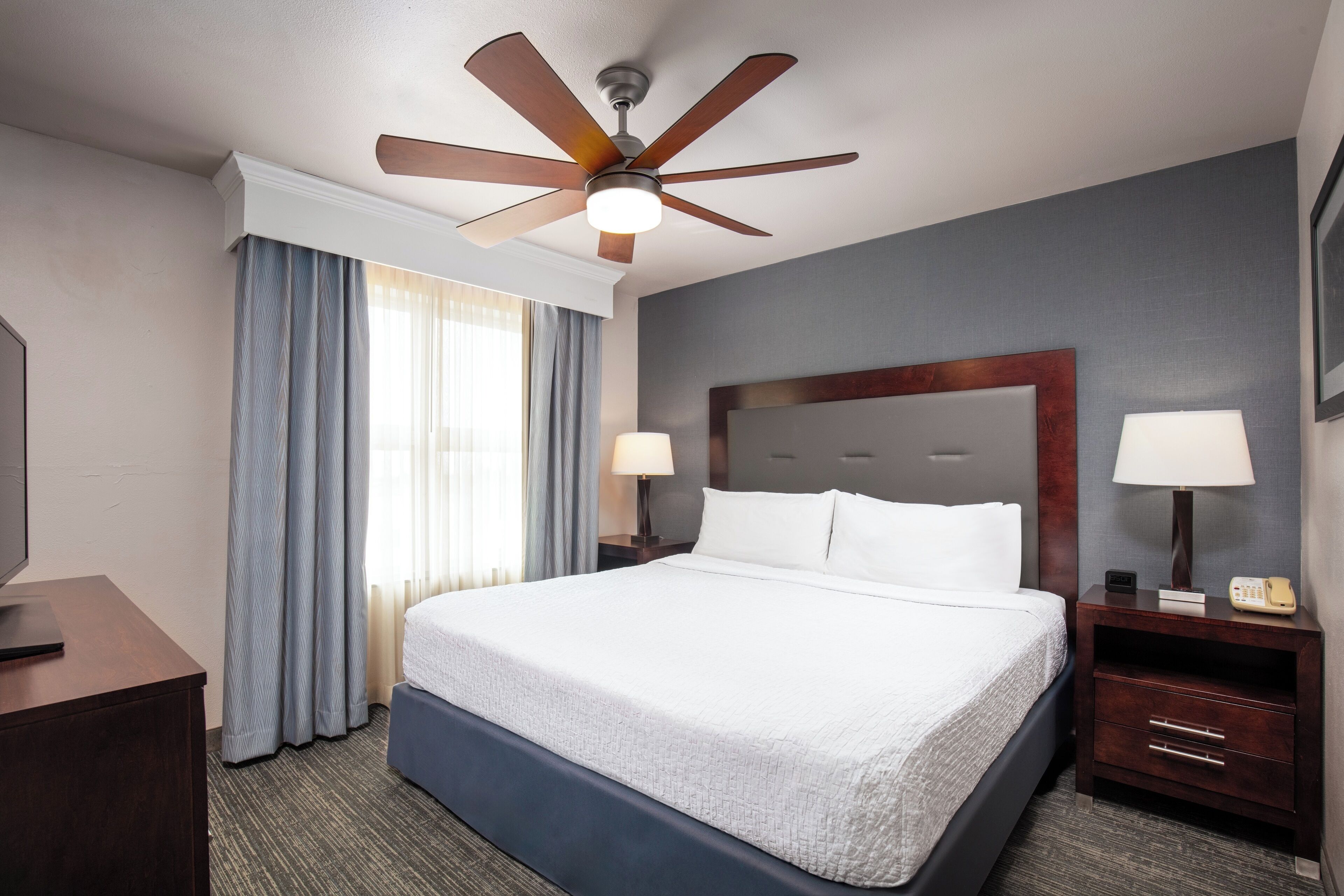 premium bedding, desk, blackout curtains, iron/ironing board