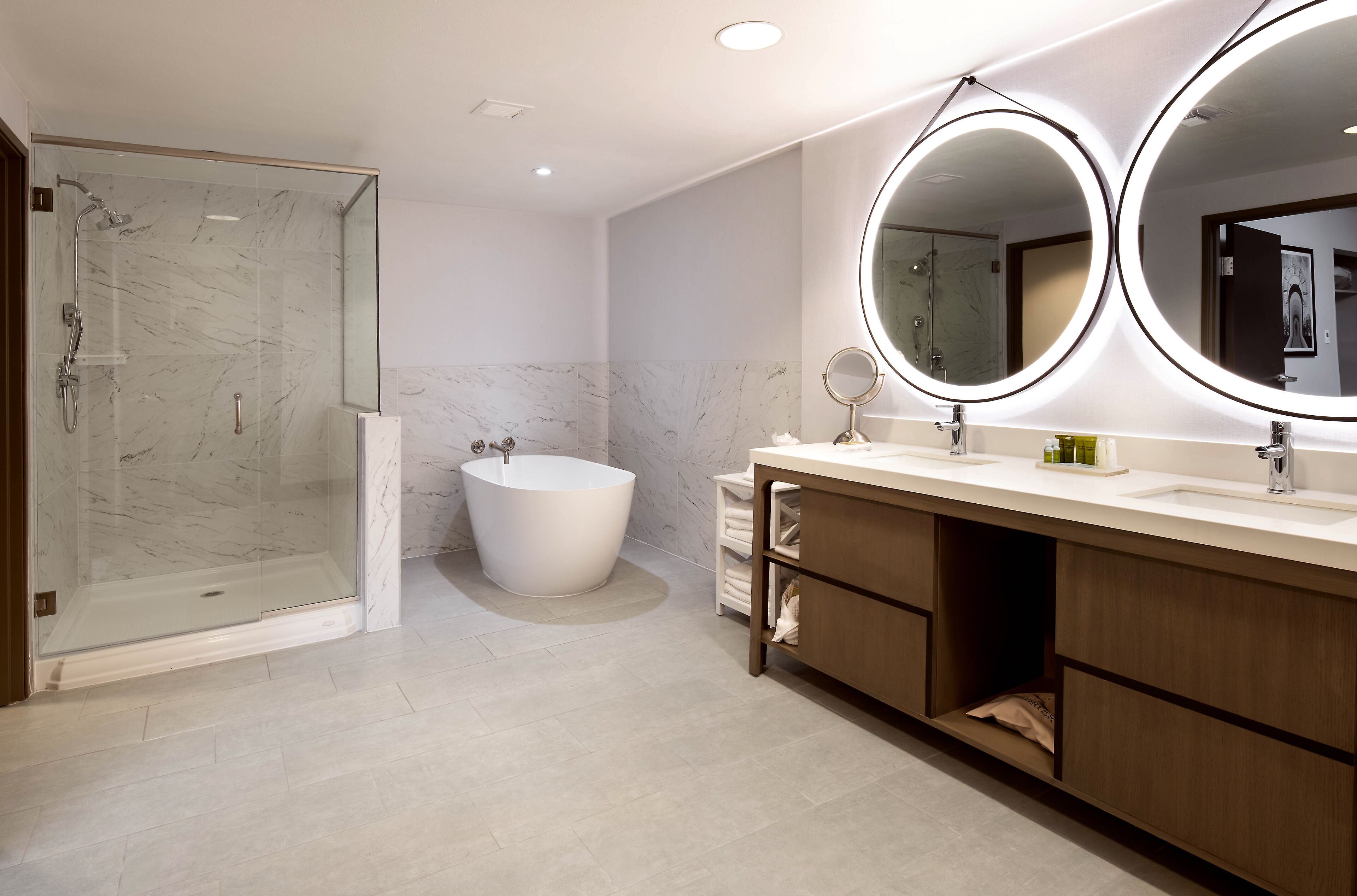 designer toiletries, hair dryer, towels