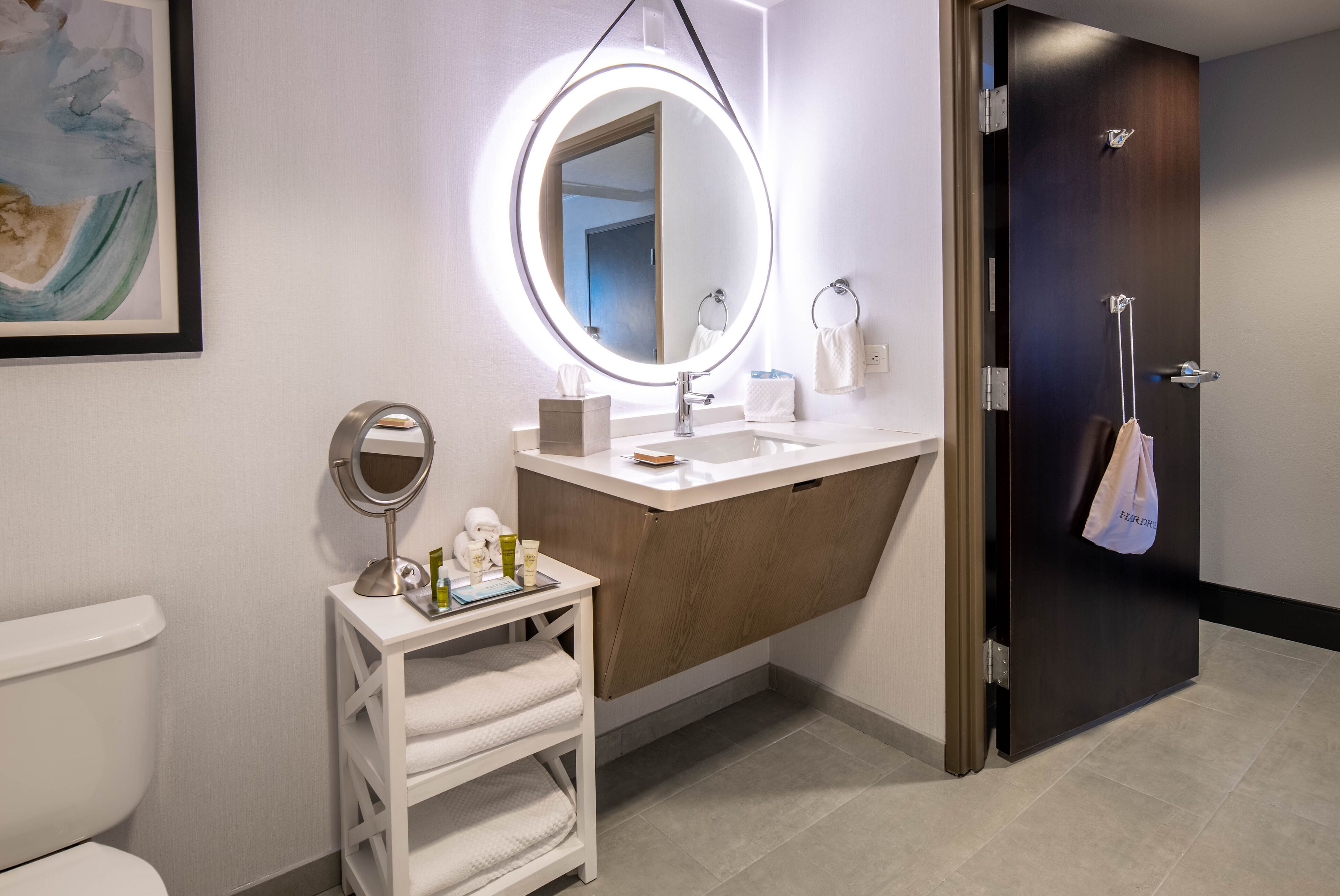 designer toiletries, hair dryer, towels