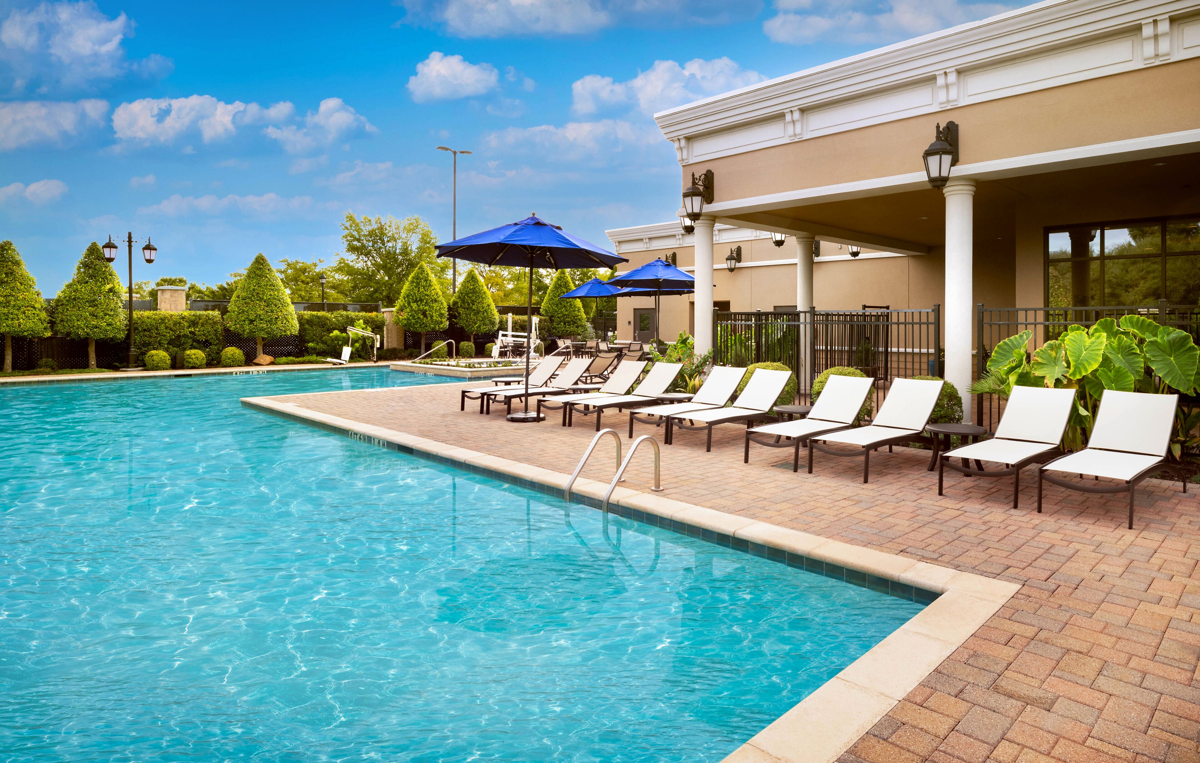 outdoor pool, pool umbrellas, pool loungers