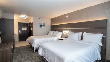 Premium bedding, desk, laptop workspace, blackout drapes