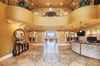 A spacious lobby with a high ceiling, chandeliers, and a view of the outdoors. at The Berkley, Orlando