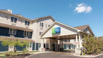 Experience the charm of this traditional hotel, featuring a pitched roof and covered entrance.