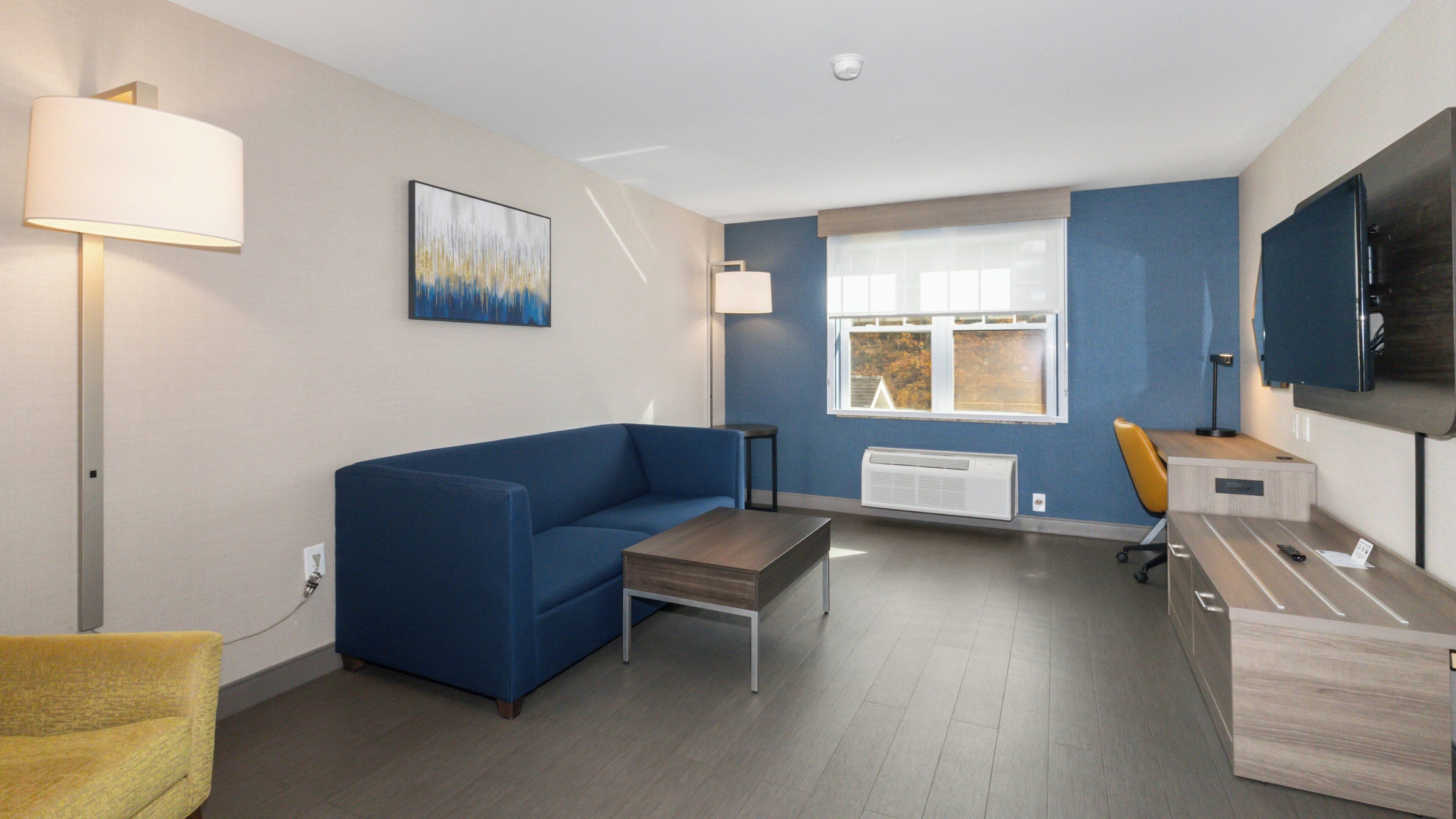 Suite, 1 King Bed with Sofa bed (Extra Living Area) | In-room safe, laptop workspace, soundproofing, iron/ironing board