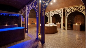 A spa area with a reception desk, multiple seating areas, and decorative arches. - Barceló Royal Beach – All Inclusive (Sunny Beach)