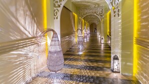 A corridor with ornate white arches and a patterned floor, leading to a distant staircase. - Barceló Royal Beach – All Inclusive (Sunny Beach)