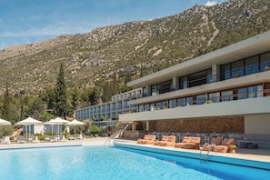 Seasonal outdoor pool, pool umbrellas, pool loungers