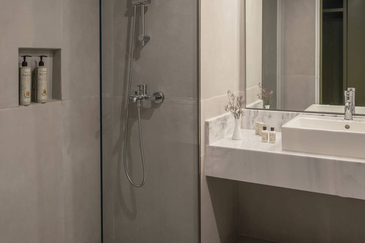 bathtub, eco-friendly toiletries, hair dryer, towels