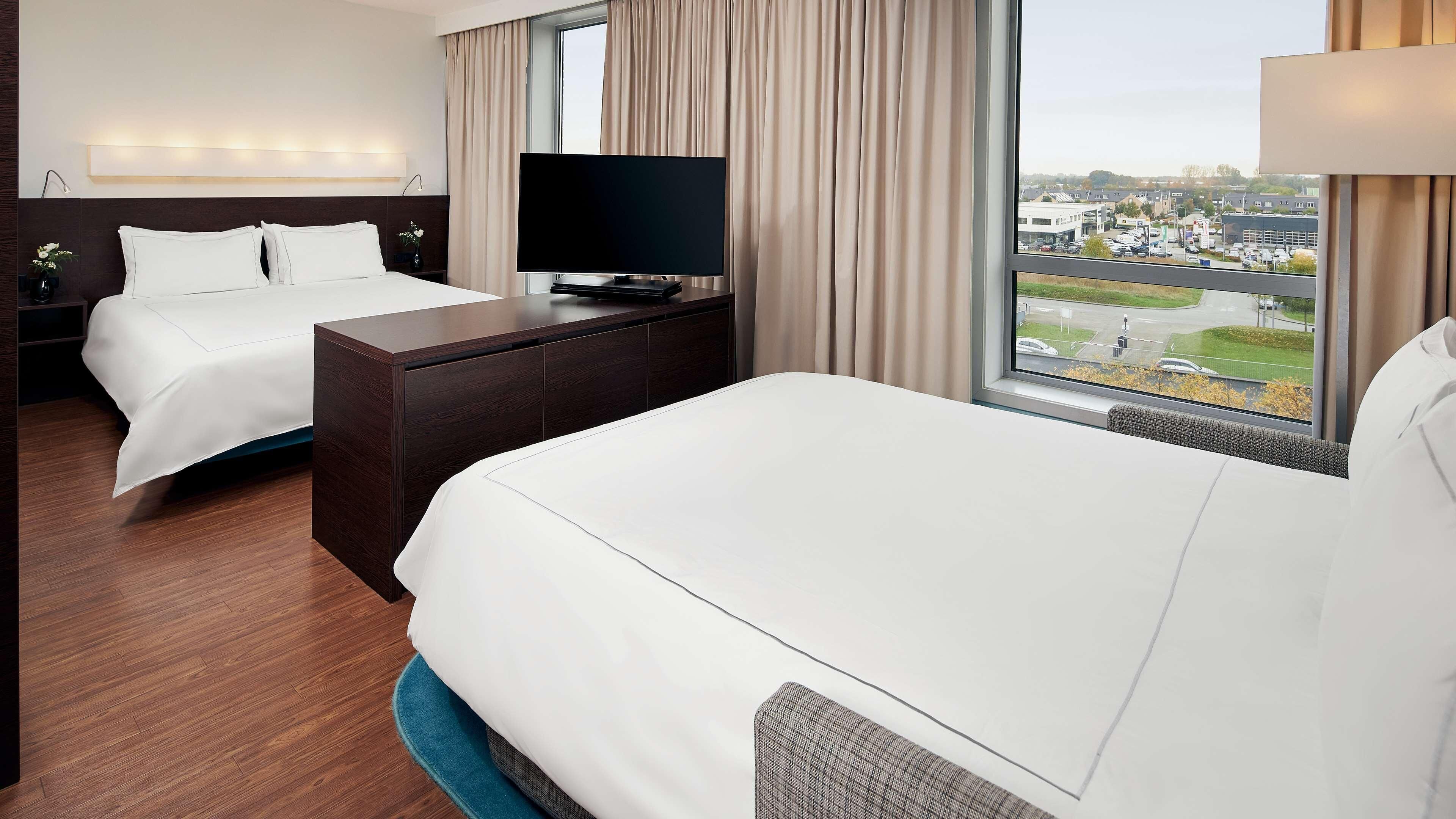 Hypo-allergenic bedding available, down comforters, minibar