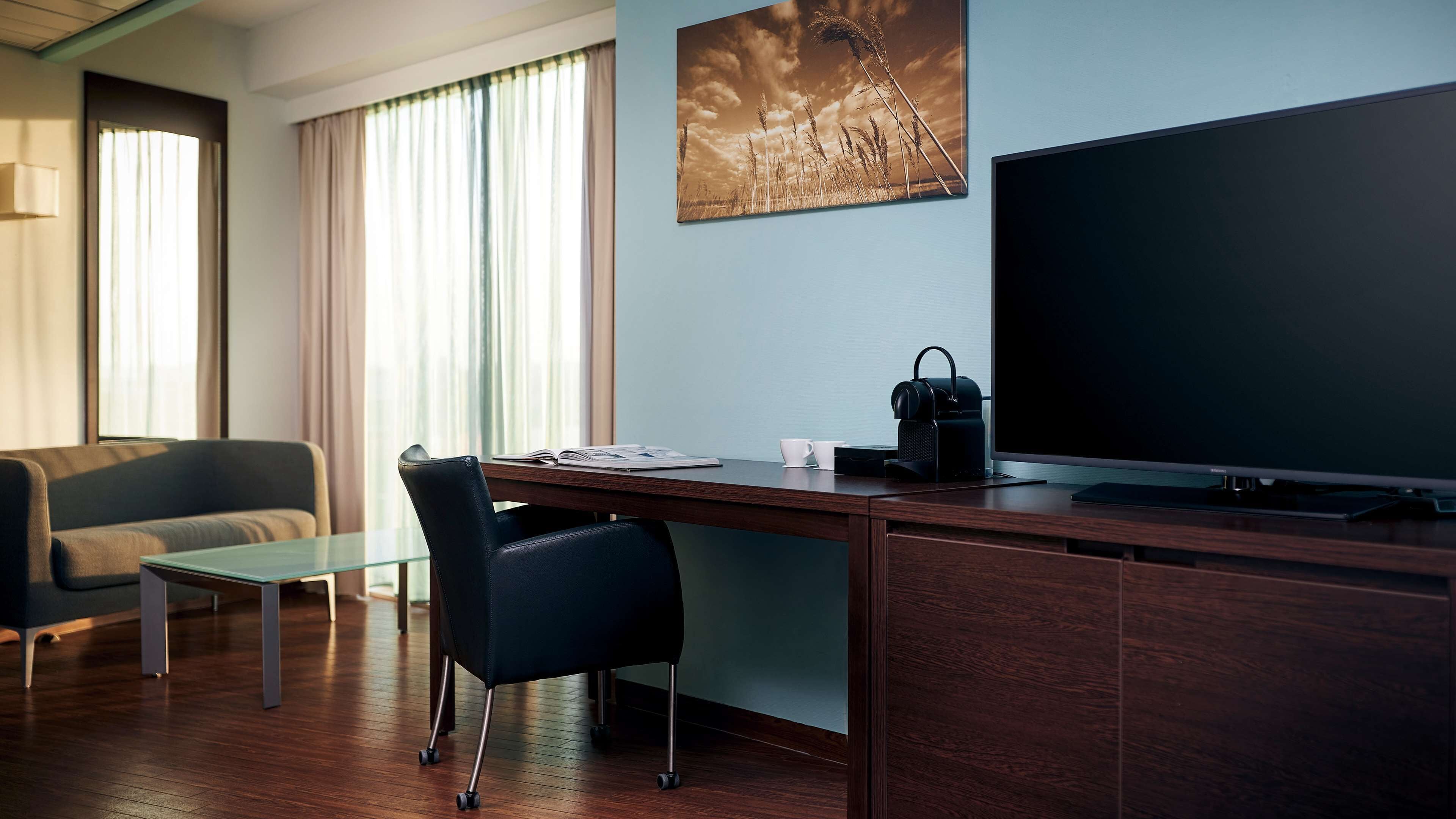 hypo-allergenic bedding, down duvets, minibar, in-room safe