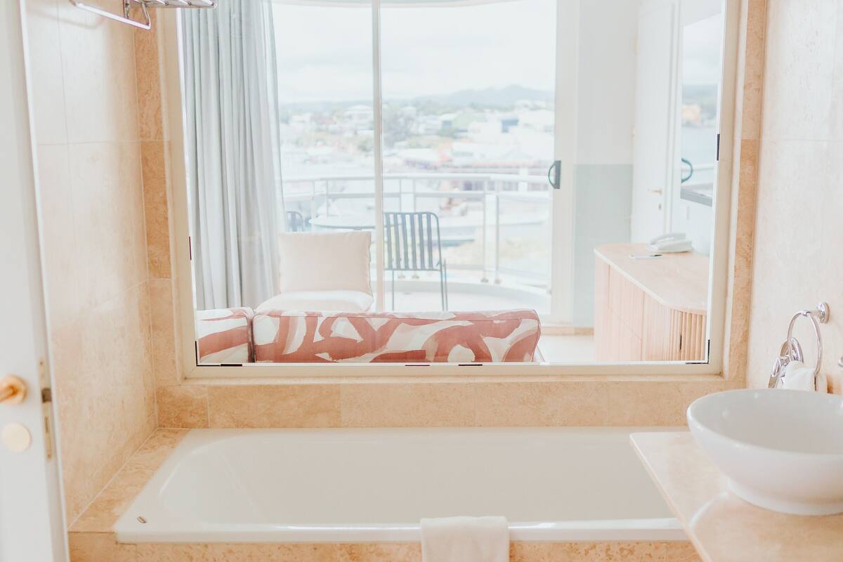 panoramic suite | bathroom | separate bathtub and shower, free toiletries, hair dryer, bathrobes