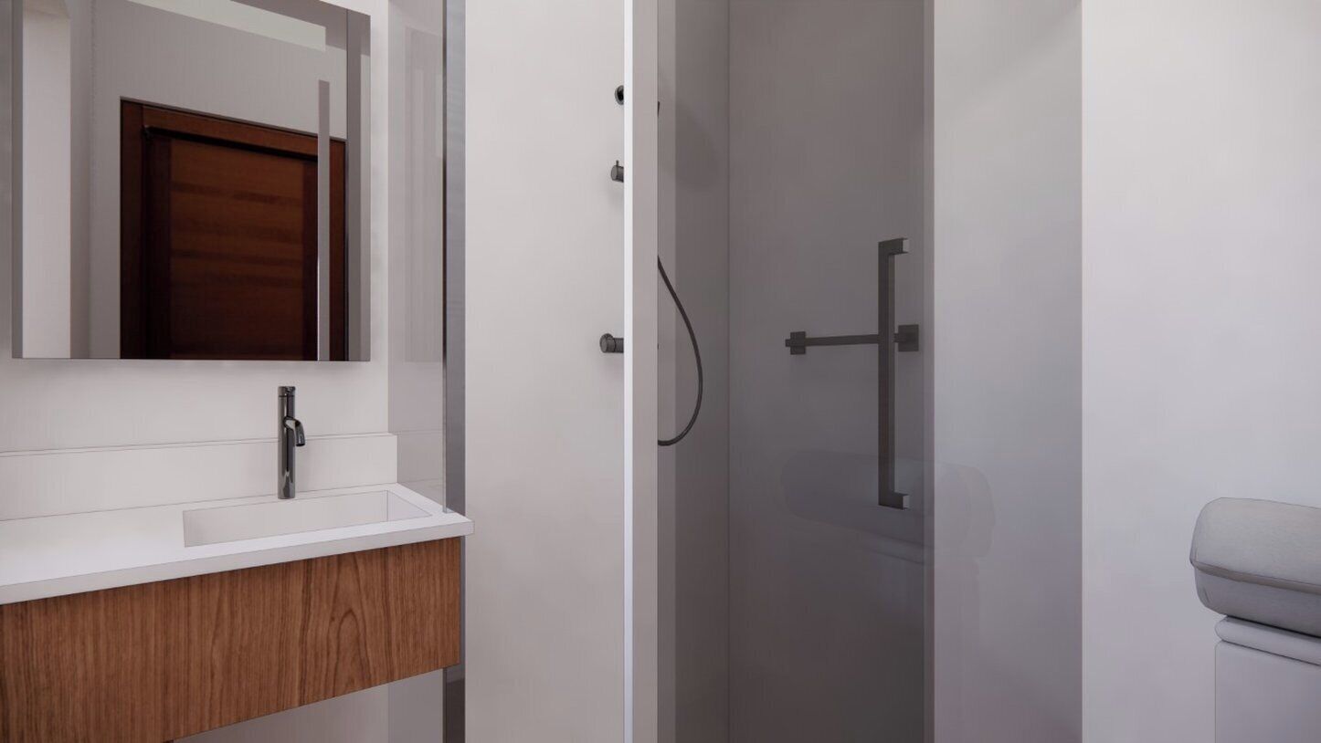 A bathroom with a white vanity, a wooden cabinet, a mirror, and a shower area.