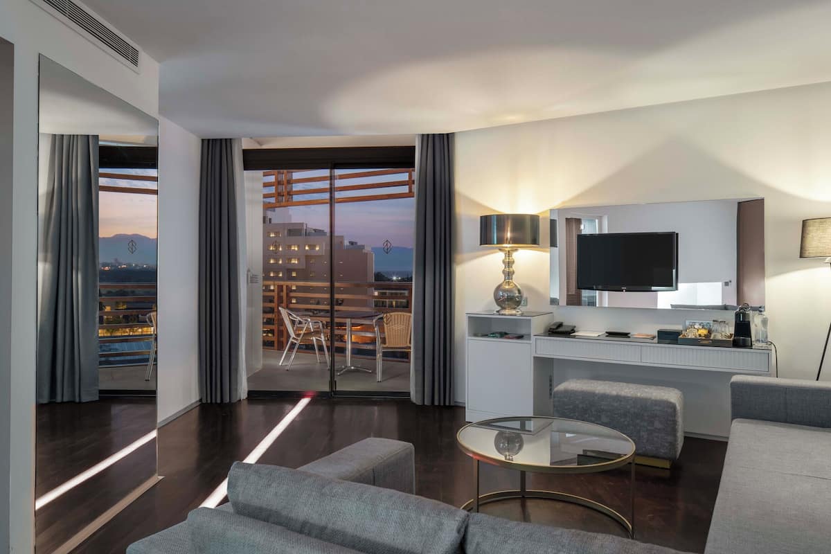 family suite | 1 bedroom, minibar, in-room safe, desk