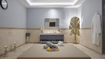 Ein modernes Badezimmer mit einer großen Badewanne, einem Waschtisch mit Spiegel und einem Handtuchhalter.