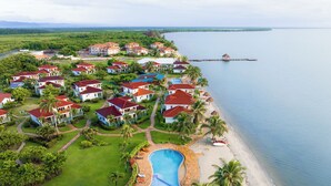 A resort with multiple buildings, a swimming pool, and a beach. - Hopkins Bay Belize, a Muy'Ono Resort (Hopkins)