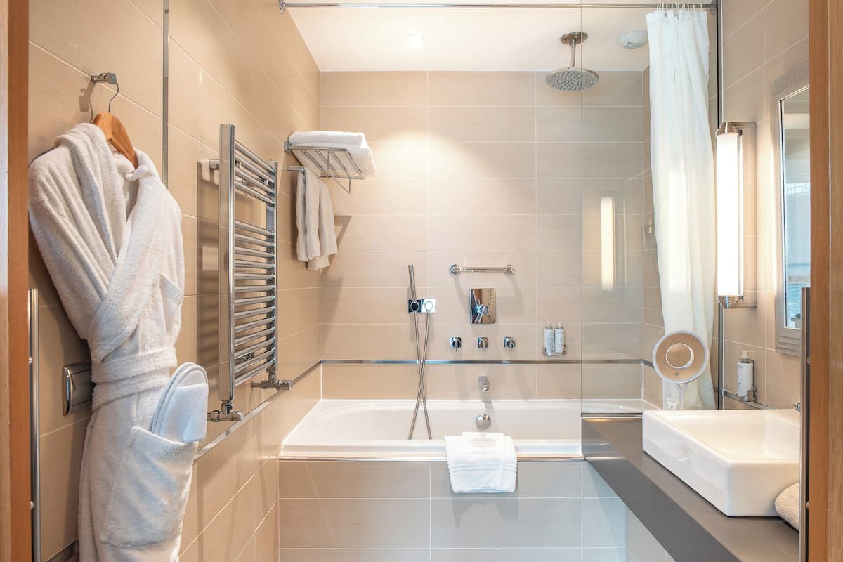 suite | bathroom | bathtub, free toiletries, hair dryer, bathrobes
