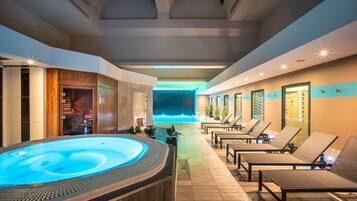 Indoor pool, open 7:00 AM to 10:00 PM, pool loungers