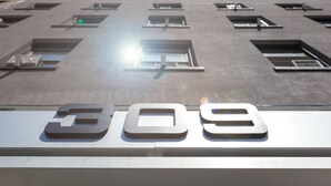 A building with a large number '309' displayed prominently at the ground level.