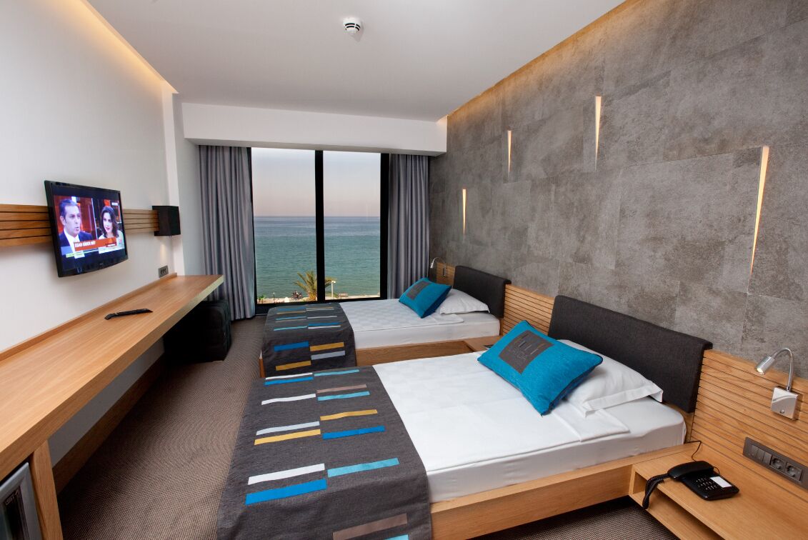 standard twin room, sea view | minibar, in-room safe, desk, blackout curtains