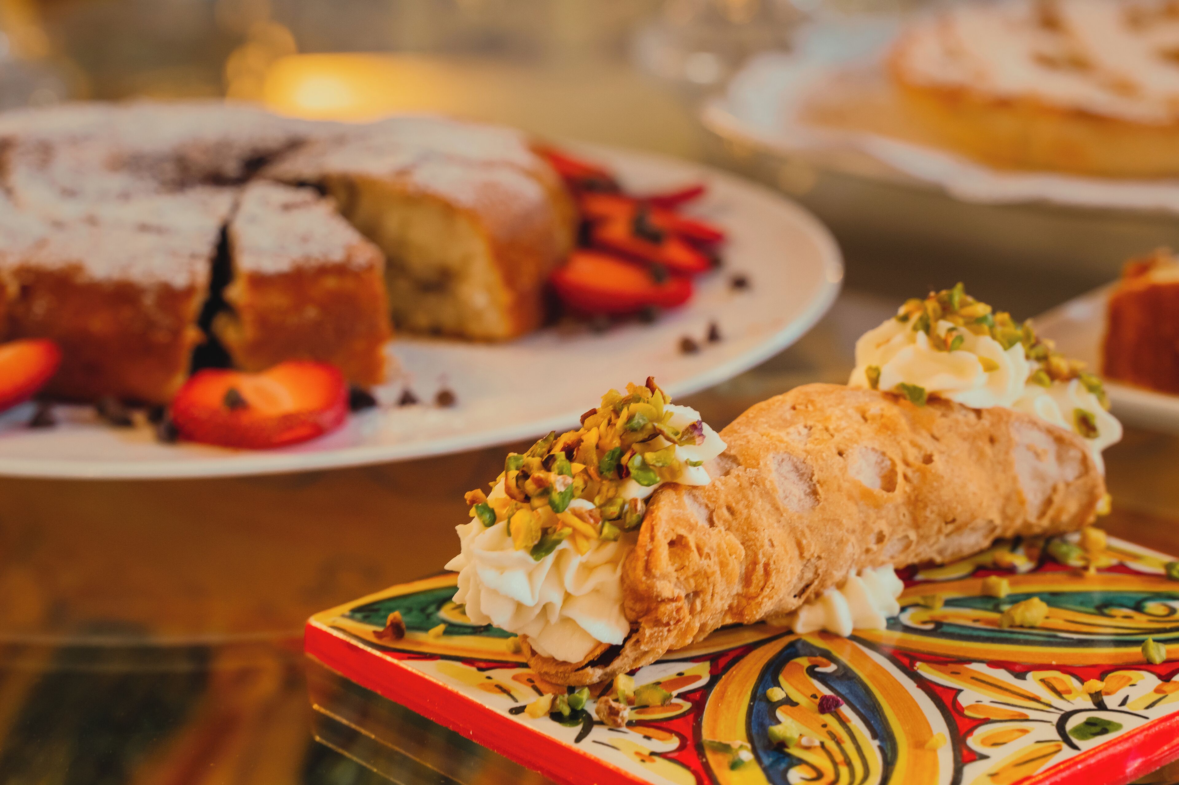 A dessert display with pastries and fruits.