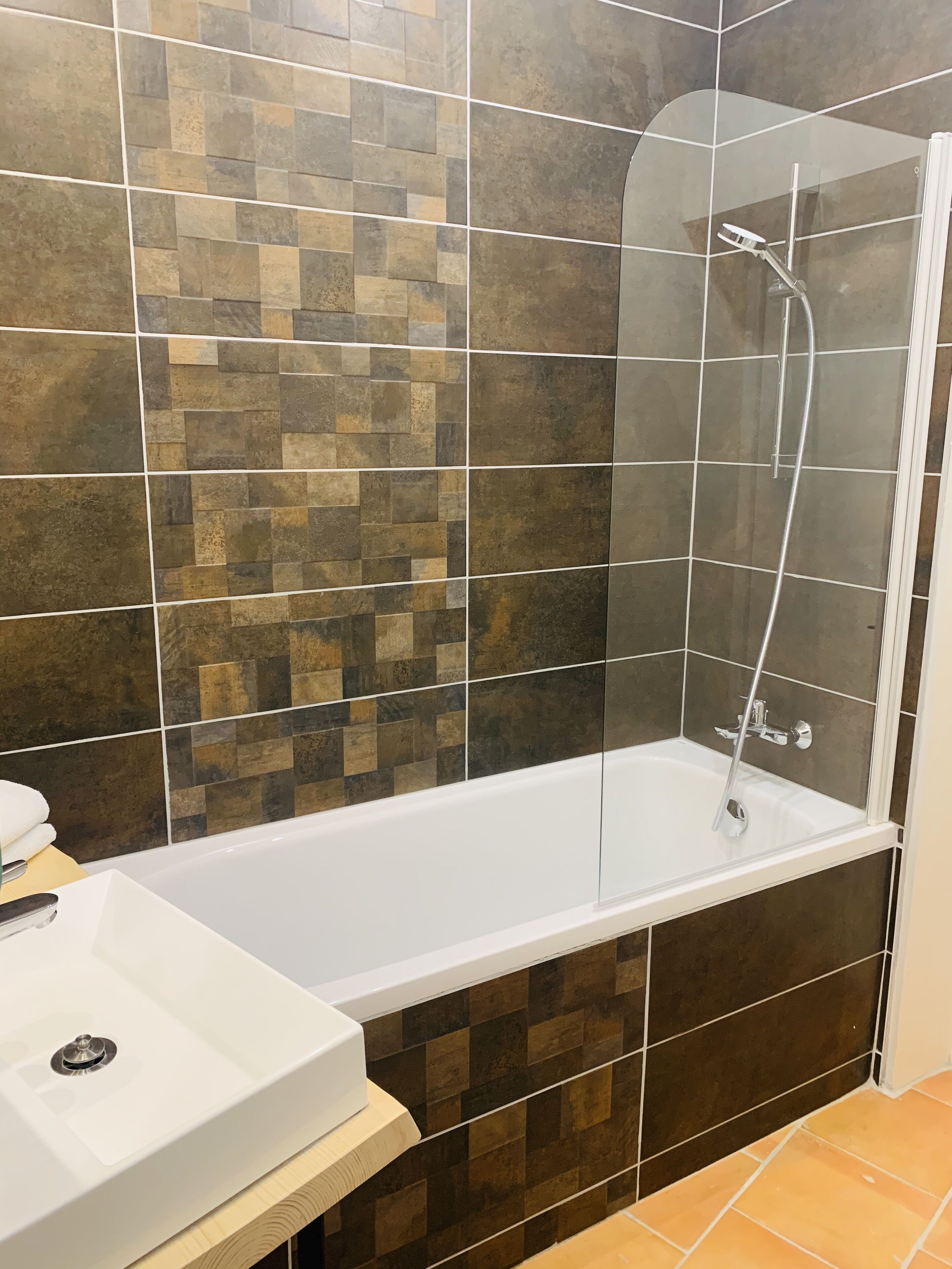 superior room | bathroom | shower, hair dryer, towels