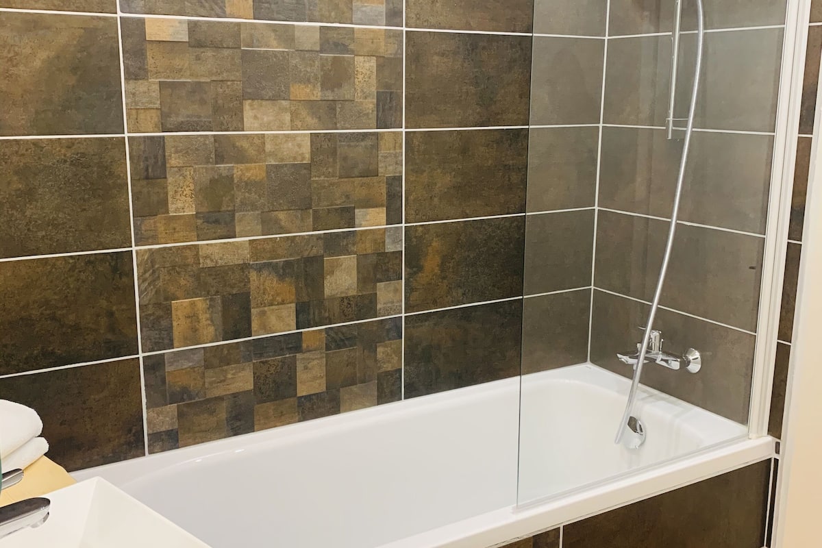 superior room | bathroom | shower, hair dryer, towels