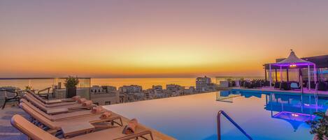 Indoor pool, outdoor pool, pool umbrellas, pool loungers