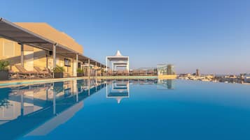 Indoor pool, outdoor pool, pool umbrellas, pool loungers