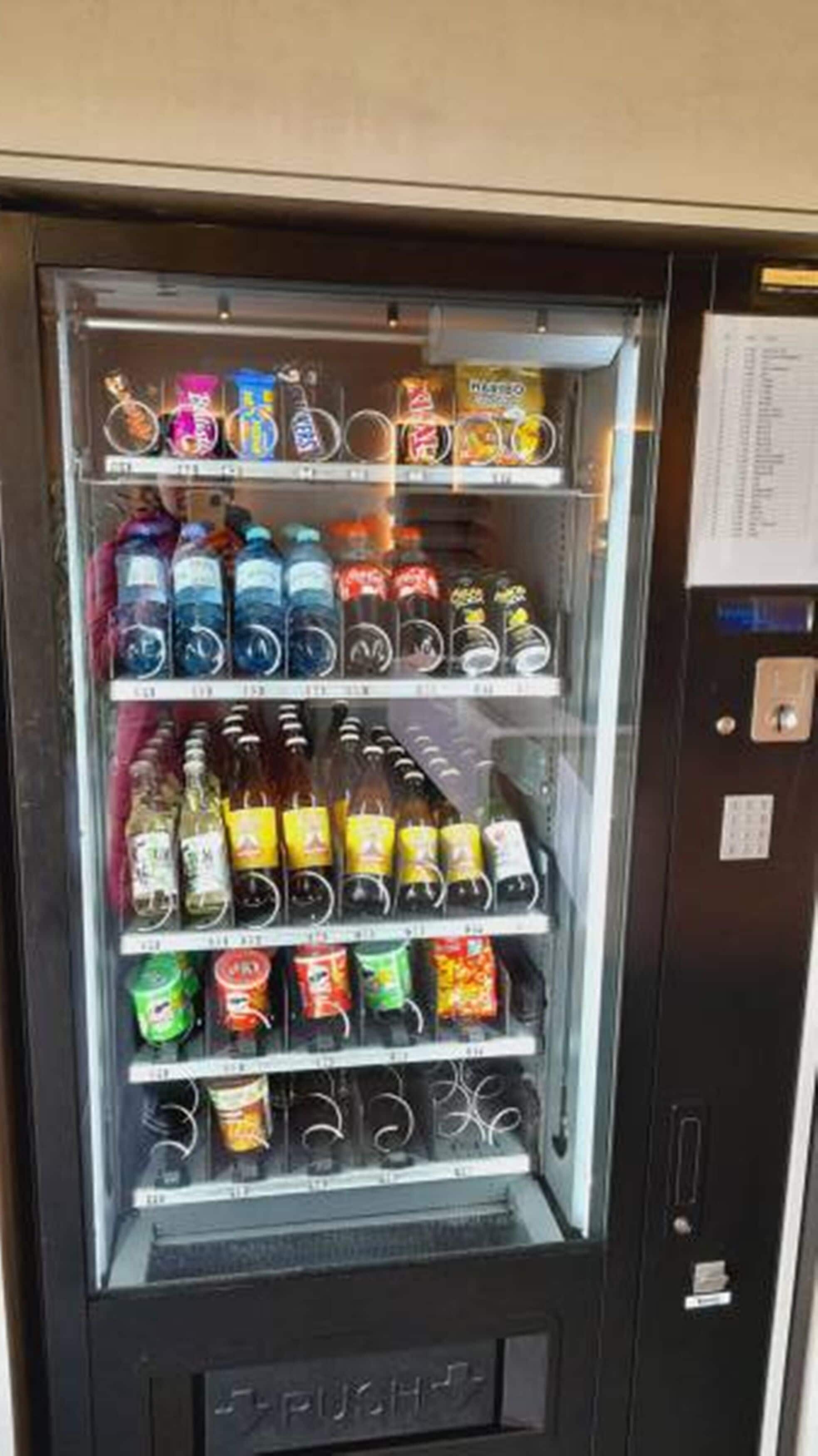 A vending machine with various beverages and snacks.