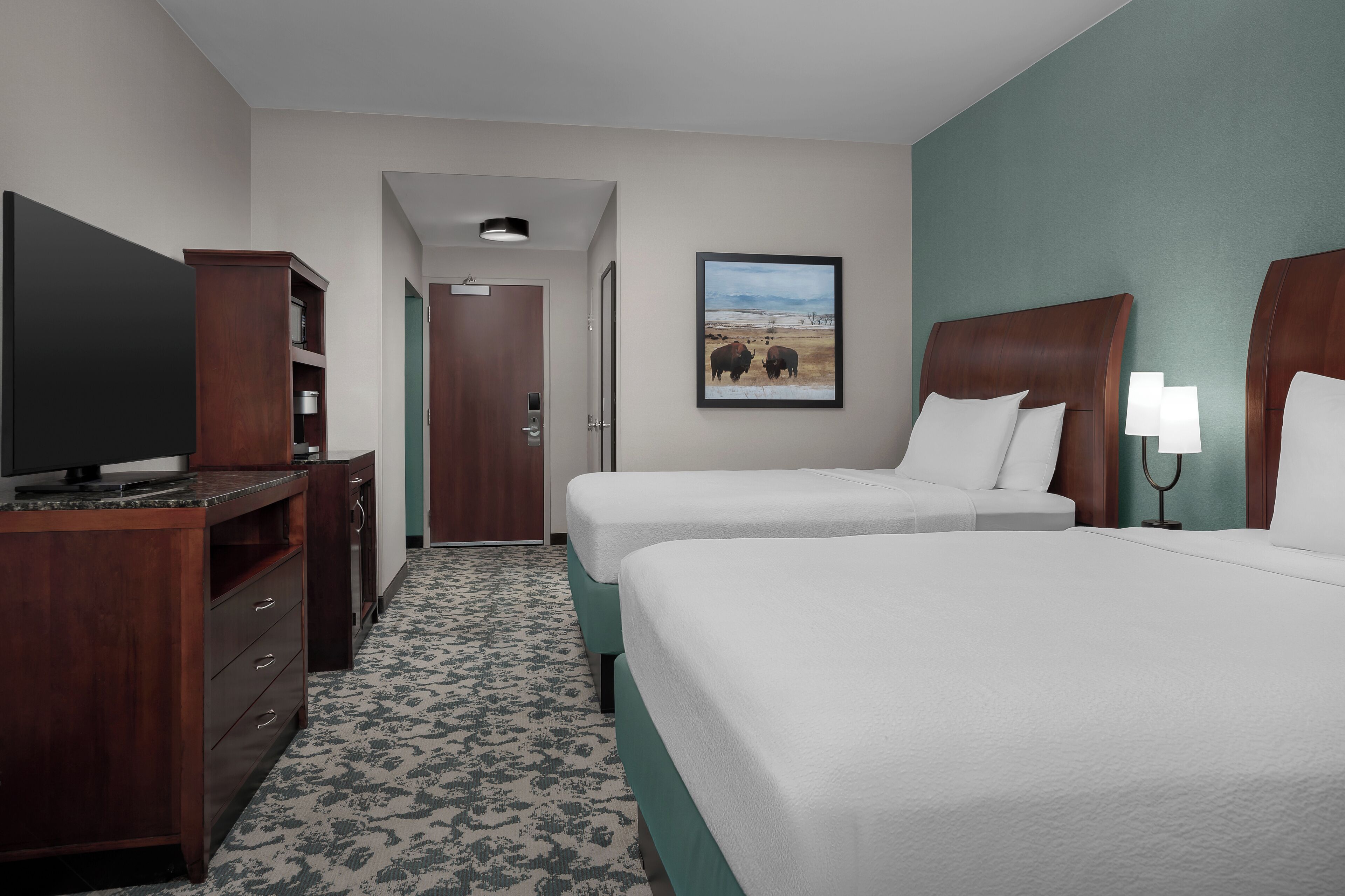 Premium bedding, desk, laptop workspace, iron/ironing board