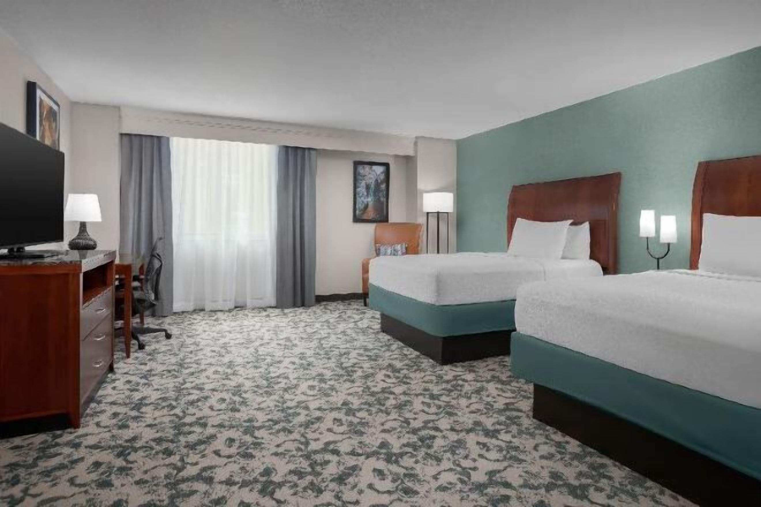 Premium bedding, desk, laptop workspace, iron/ironing board