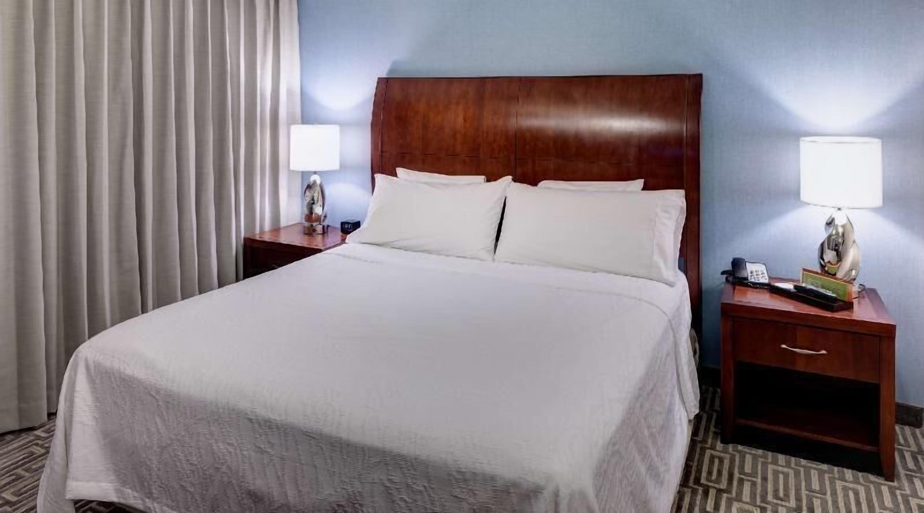 Premium bedding, desk, laptop workspace, iron/ironing board
